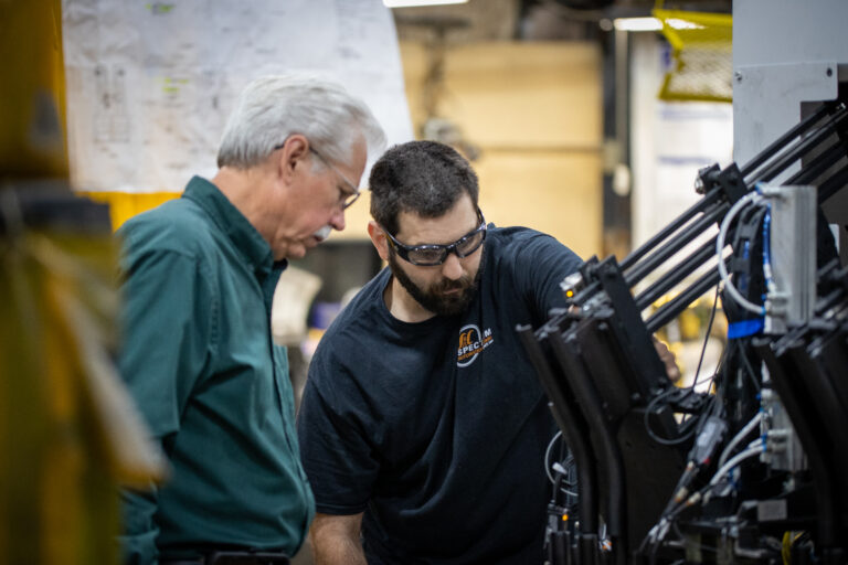 two men talking to eachother about a project